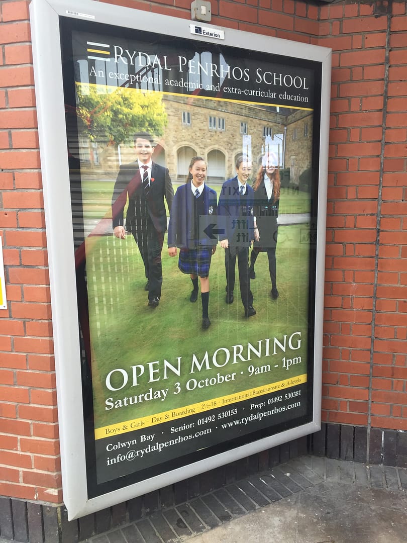 An A0 poster in situ at a railway station advertising the local independent school.